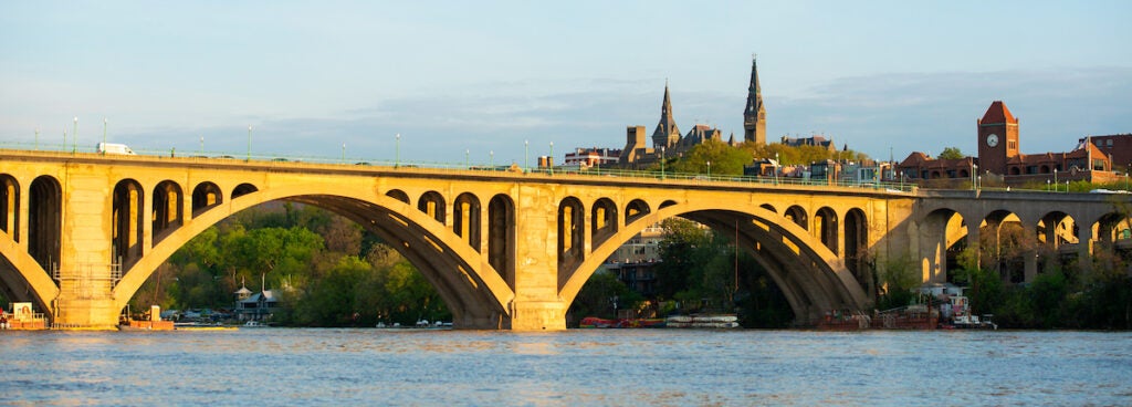 Sunrise on the Key Bridge over the Potomac River. Georgetown University can be seen in the background.