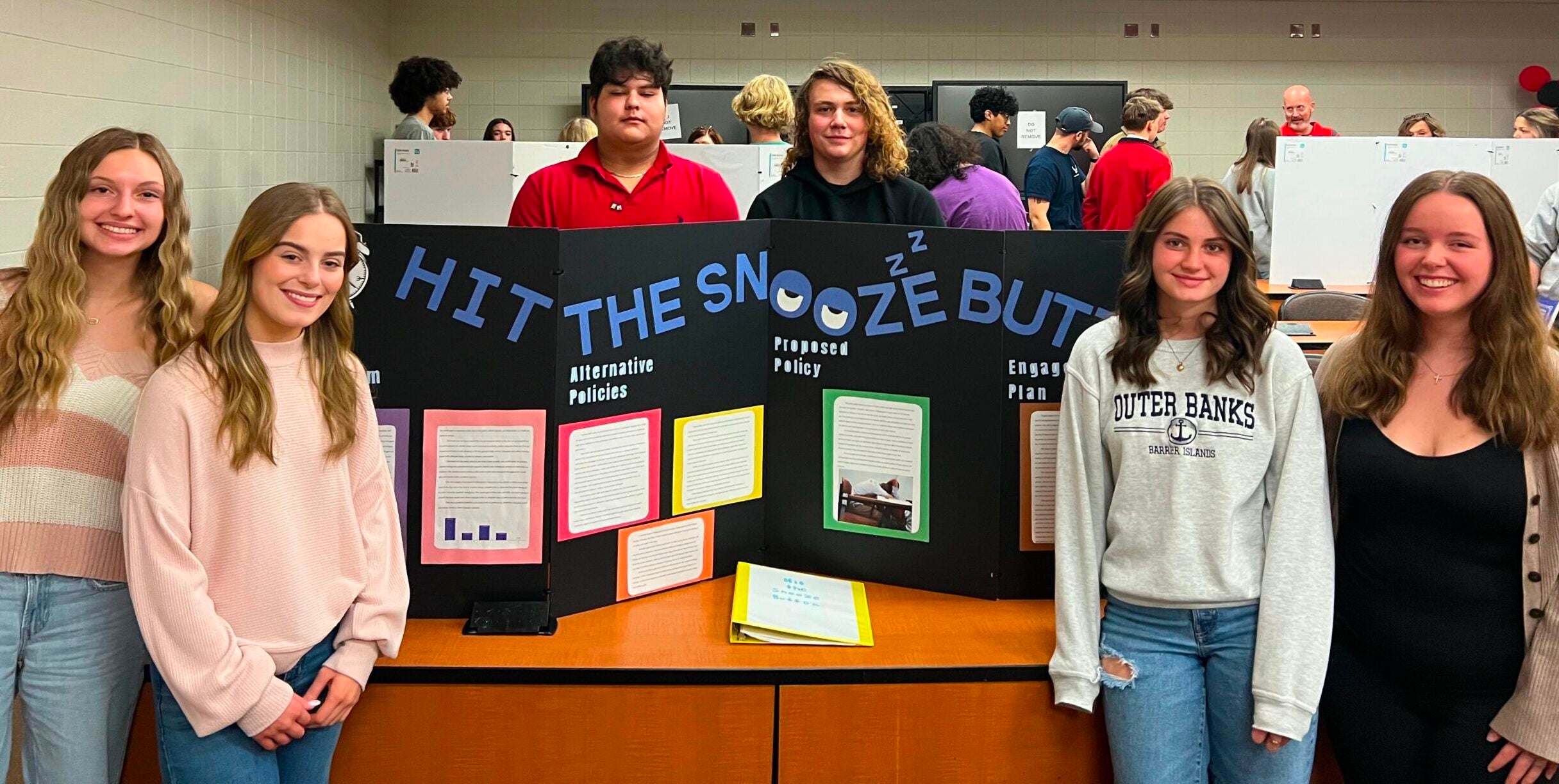 University High team with their presentation board on Hit the Snooze Button: A Policy Project on Delaying School Start Times University High team with their presentation board on Hit the Snooze Button: A Policy Project on Delaying School Start Times