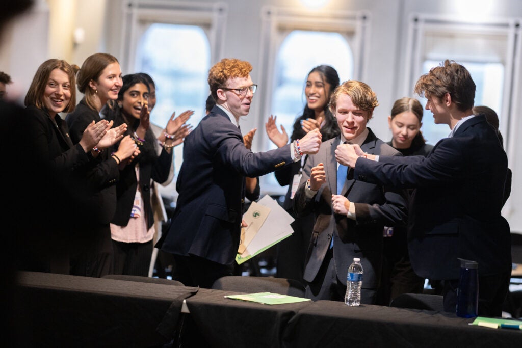 Student celebrates success at We the People finals with high five.